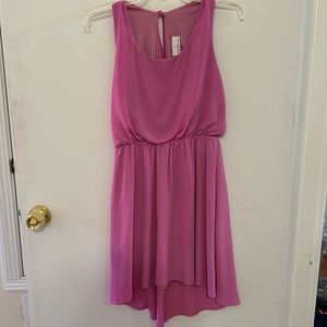 Pink dress with tie in the back. Size large. In good condition.